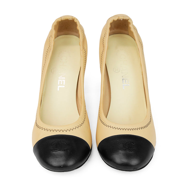 Chanel Beige 
Black CC Cap Toe Pumps