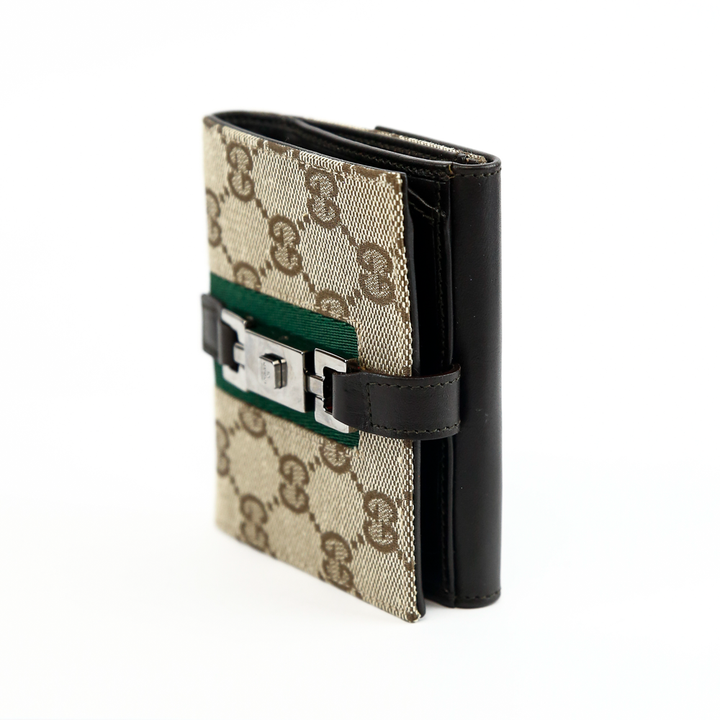 side view of Gucci GG Canvas 
Leather Jackie Compact Wallet