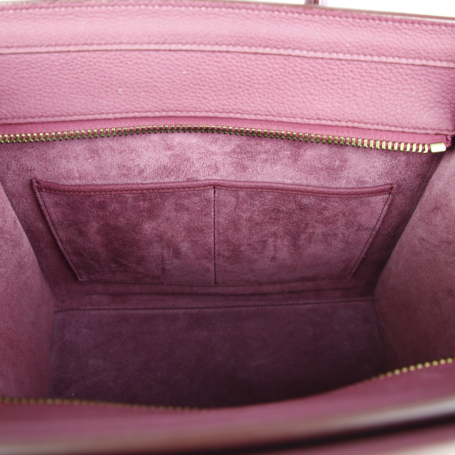 Interior pocket view of Celine Berry Baby Drummed Clafksin Leather Micro Luggage