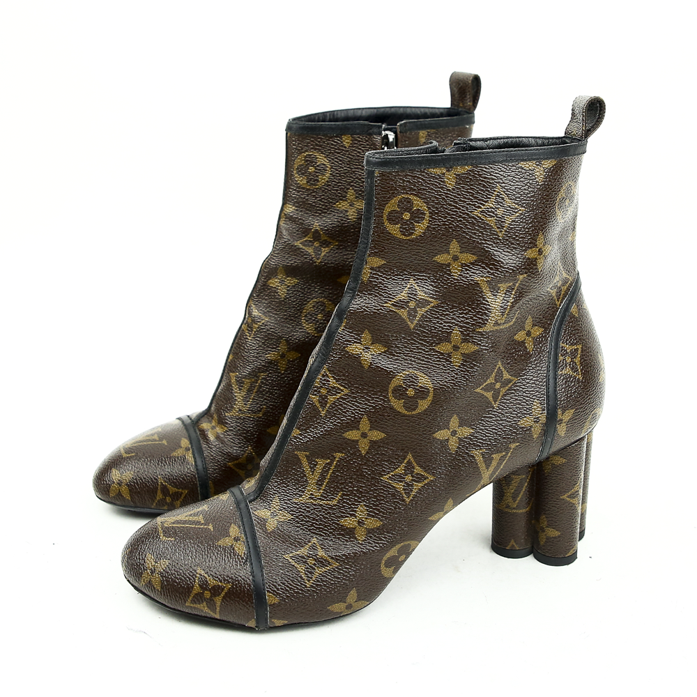 side view of Louis Vuitton Monogram Canvas New Revival Ankle Boots