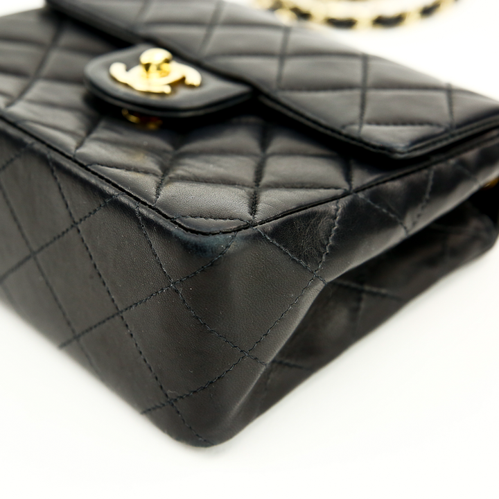 Corner view of Chanel Black Lambskin Classic Square Mini Flap Bag (2000)