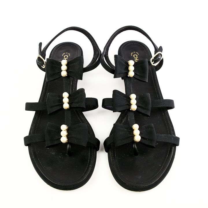 Front view of Chanel Black Fabric 
Pearl Bow Sandals