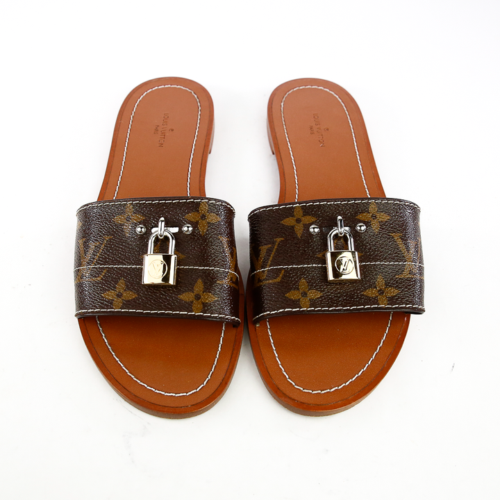 Front view of Louis Vuitton Lock It Monogram Canvas Slides