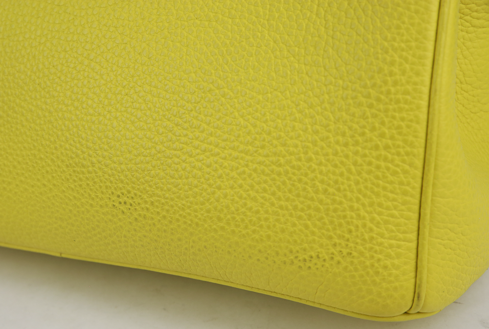 corner view of Dior Yellow Pebbled Leather Diorissimo Tote Bag