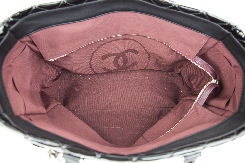 Interior view of Chanel Black Quilted Patent Leather Limited Edition Travel Tote