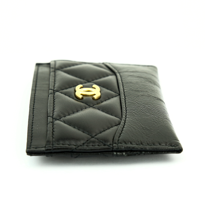 Side view of Chanel Gabrielle Quilted Black Lambskin 
Calf Leather Card Case