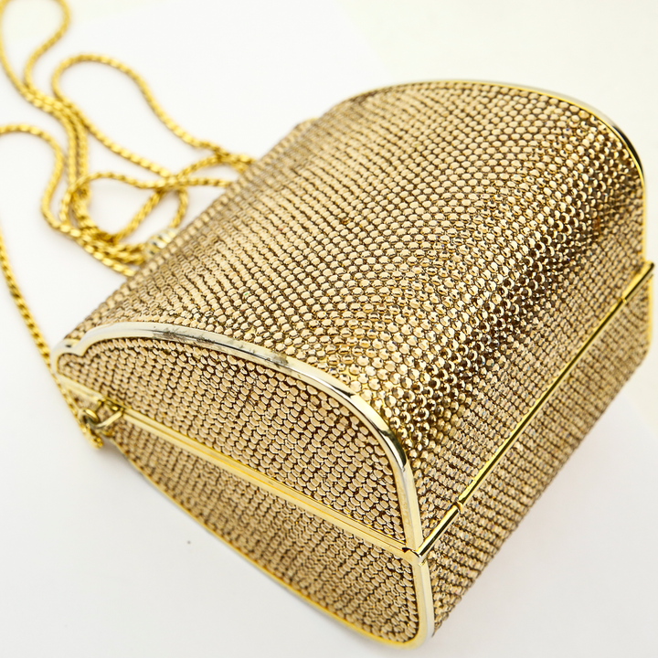 corner view of Judith Leiber Minaudiere Gold Box Clutch