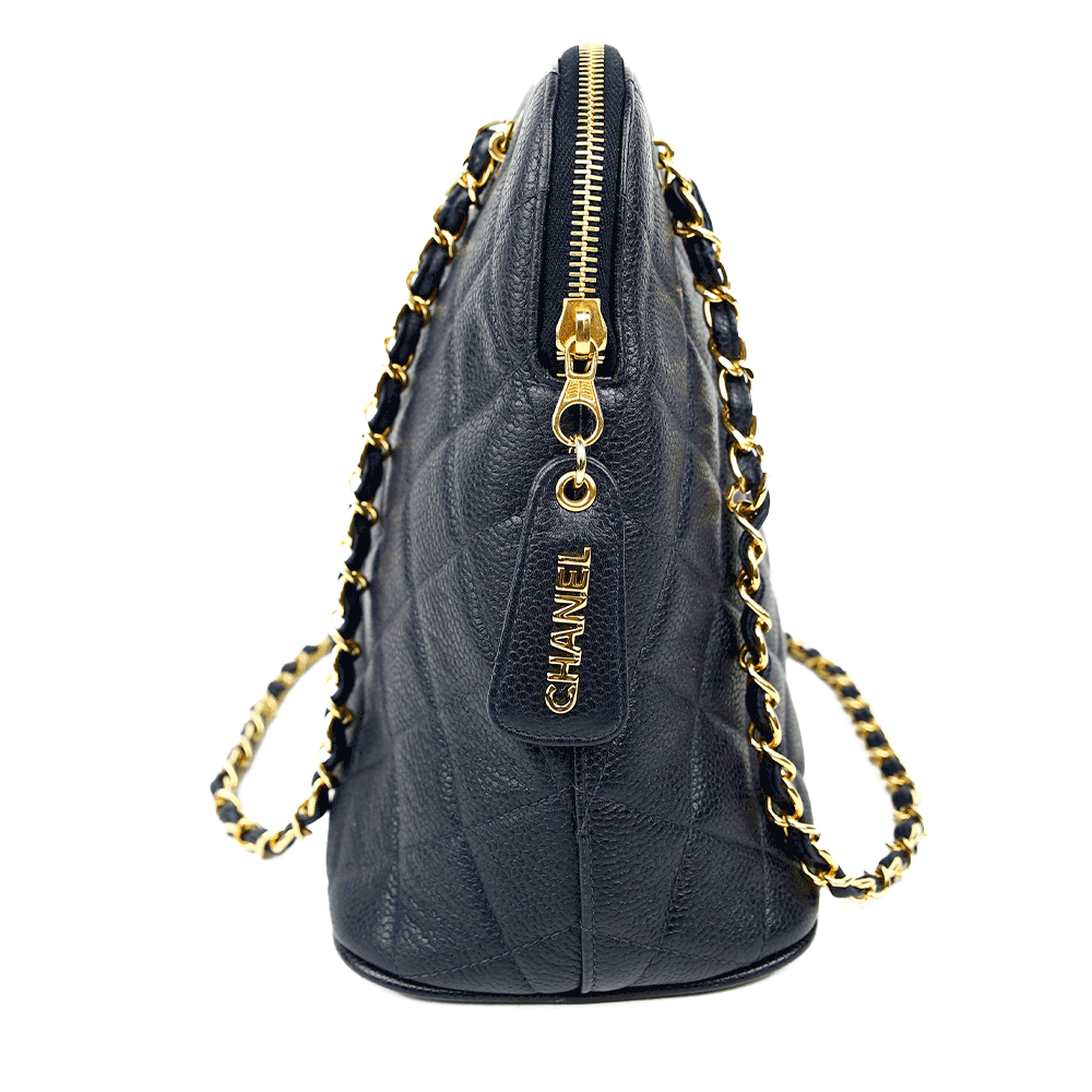 side view of Chanel Vintage Navy Caviar Quilted Dome Handbag