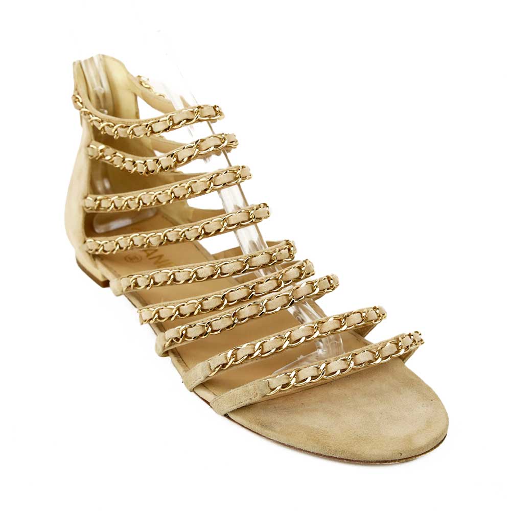 side view of Chanel Beige Kid Suede CC Chain Gladiator Sandals