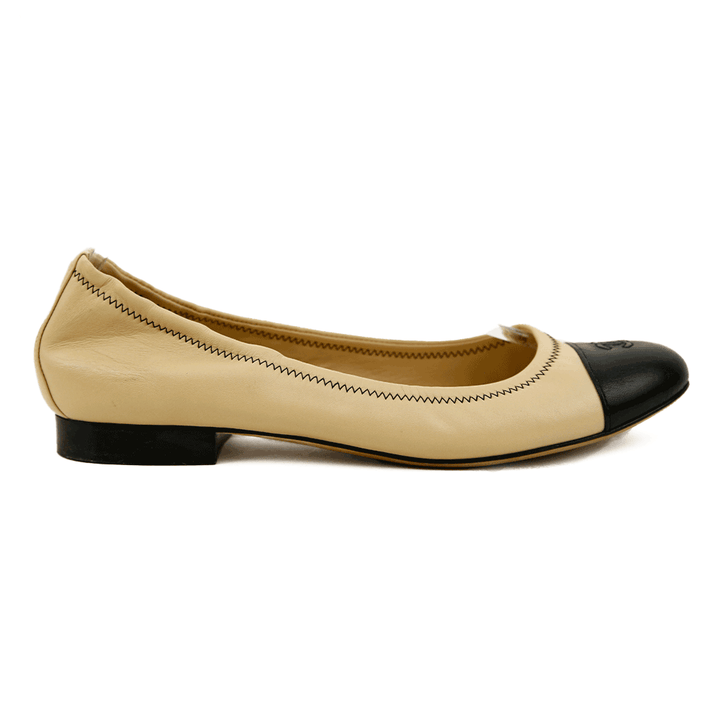 side view of Chanel Beige 
Black Leather Vintage Ballet Flats