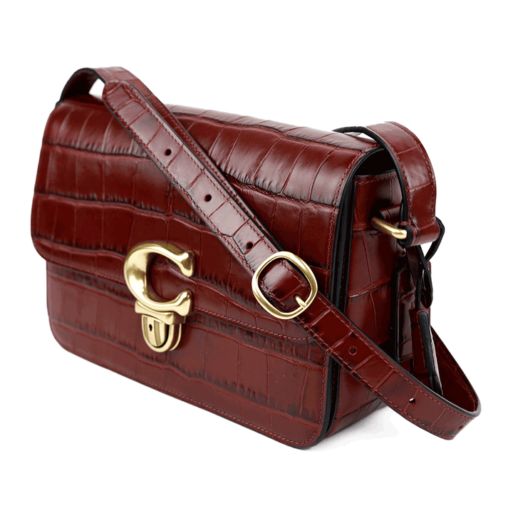 side view of Coach Studio Wine Croc Embossed Leather Satchel