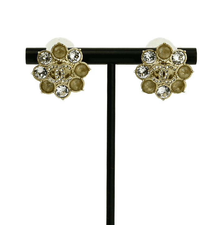 Front view of Chanel Gold Tone 
Crystal CC Flower Earrings