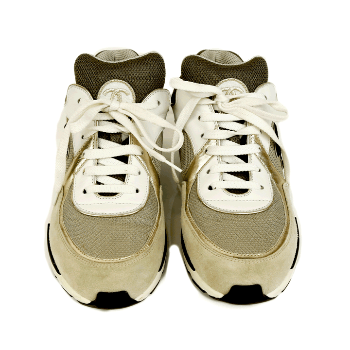 front view of Chanel Interlocking CC Gray 
Gold Sneakers