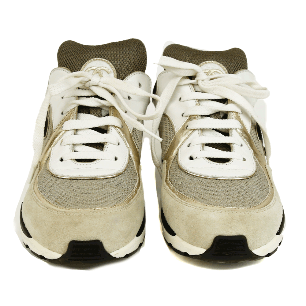 front view of Chanel Interlocking CC Gray 
Gold Sneakers