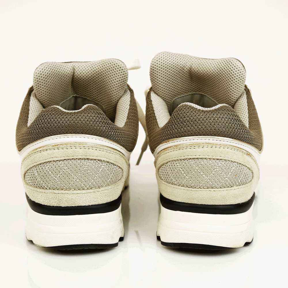 back view of Chanel Interlocking CC Gray 
Gold Sneakers