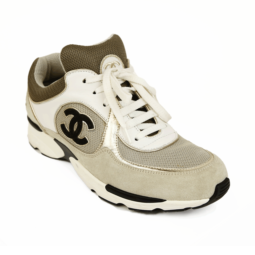 side view of Chanel Interlocking CC Gray 
Gold Sneakers