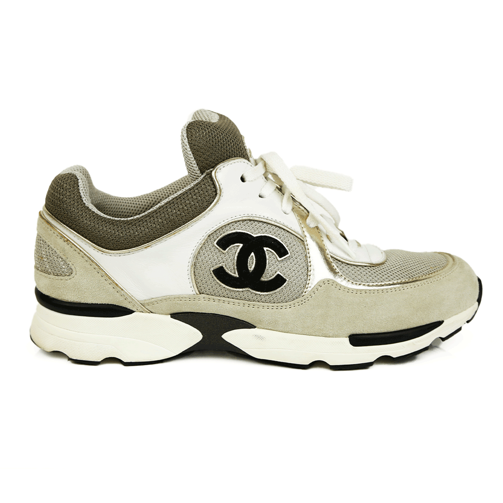 side view of Chanel Interlocking CC Gray 
Gold Sneakers