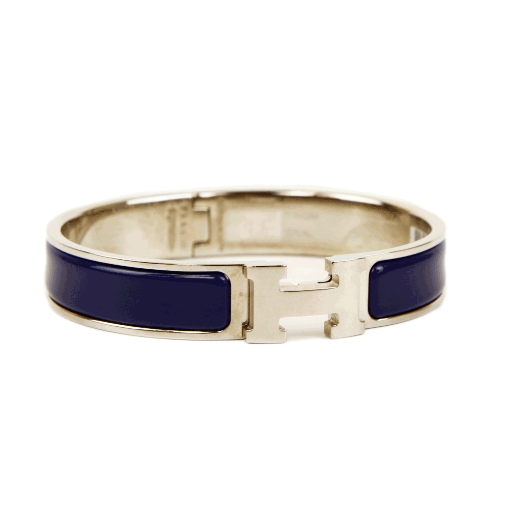 side view of Hermès Navy 
Silver Clic H Bangle