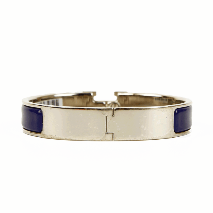 back view of Hermès Navy 
Silver Clic H Bangle