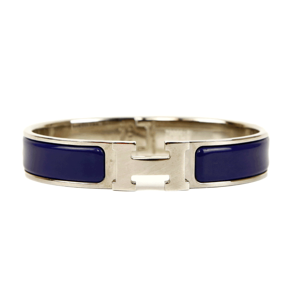 front view of Hermès Navy 
Silver Clic H Bangle