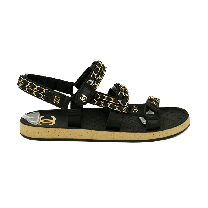 side view of Chanel Black Leather 
Chain Flat Dad Sandals